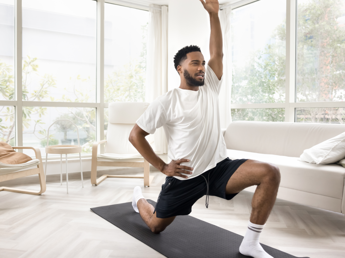 A participant moving slowly through a seated floor mobility pattern on a mat